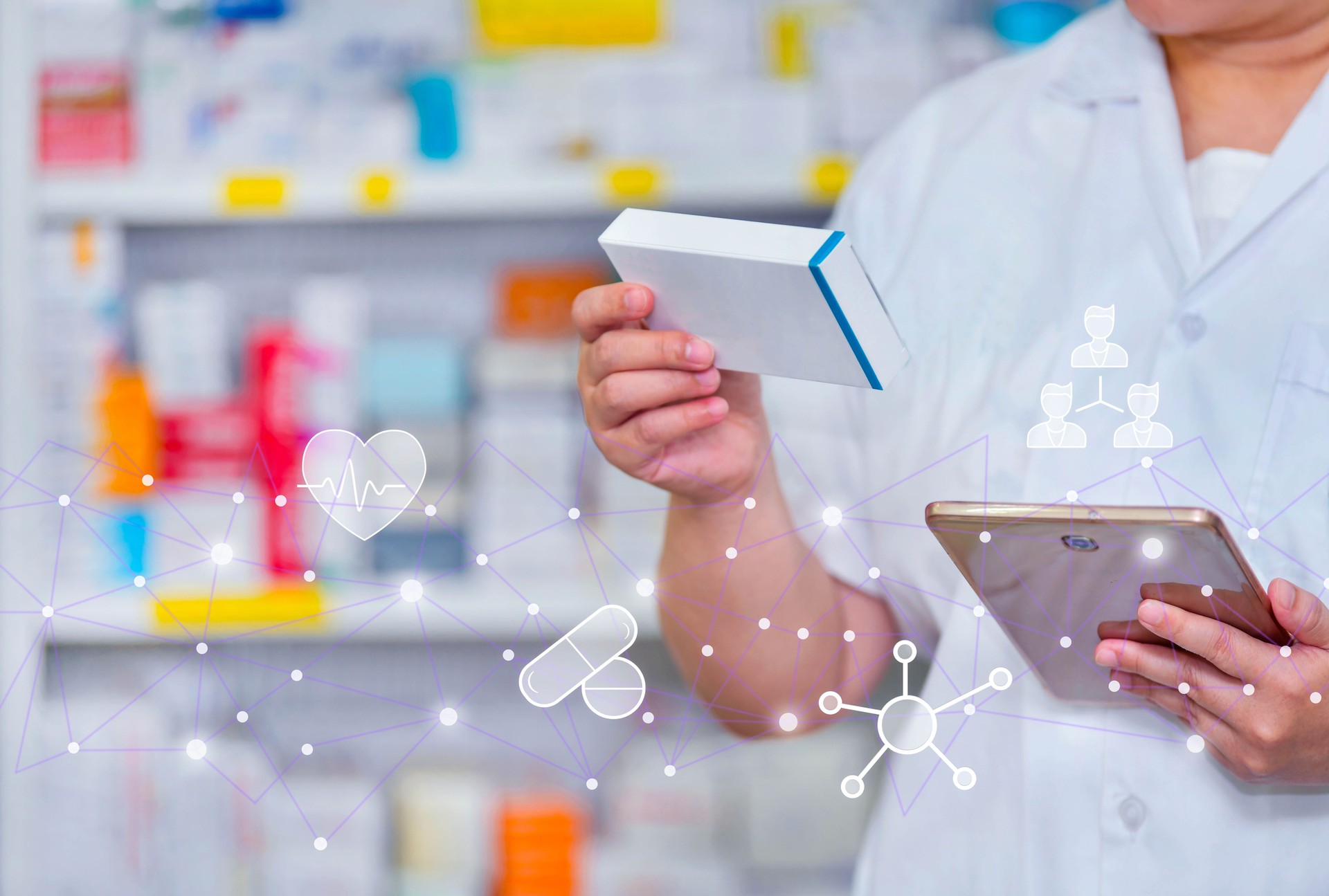 Pharmacist holds a computer tablet to receive a doctor's prescription, prepare medicine and check medicine in a pharmacy.